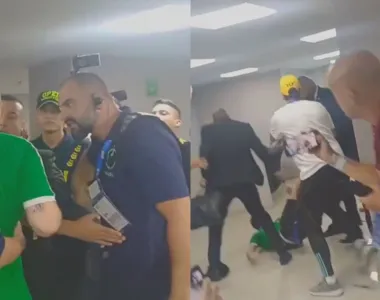 Um dos membros da Federação Colombiana de Futebol chega a cair no chão