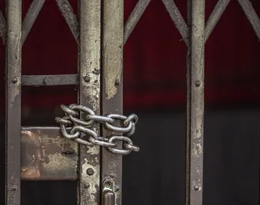 Closeup of chained sliding grille door
